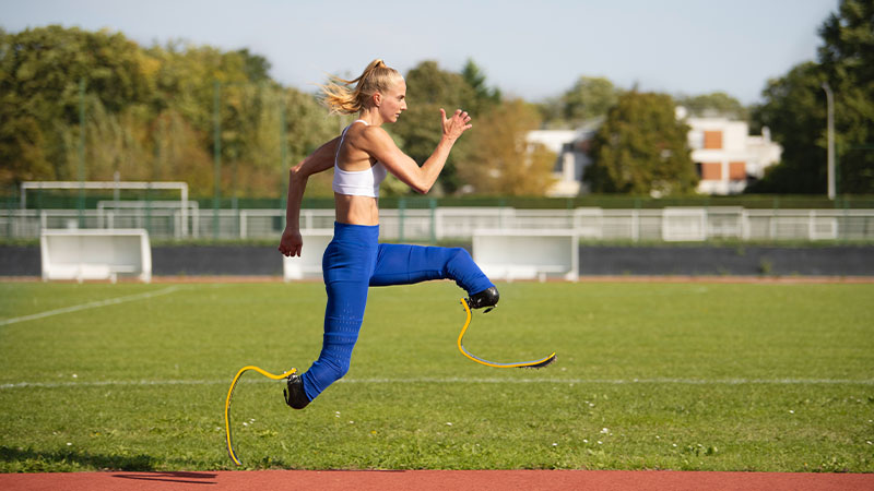 A women with two prosthetic legs running